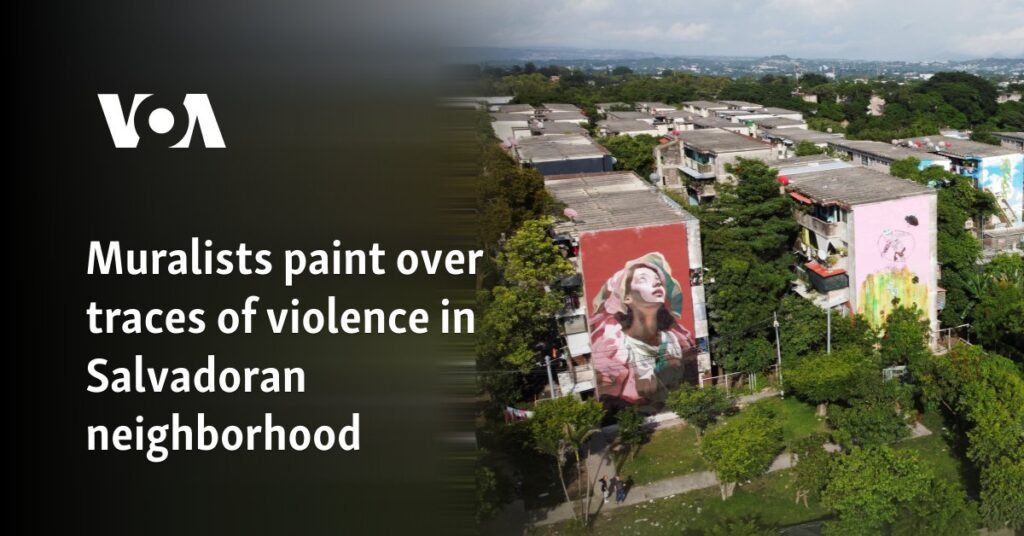 Muralists paint over traces of violence in Salvadoran neighborhood