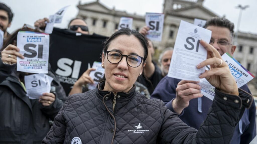 Union leader Karina Sosa campaigns in support of proposed changes to Uruguay’s pension system outside the legislature in Montevideo on Oct. 13