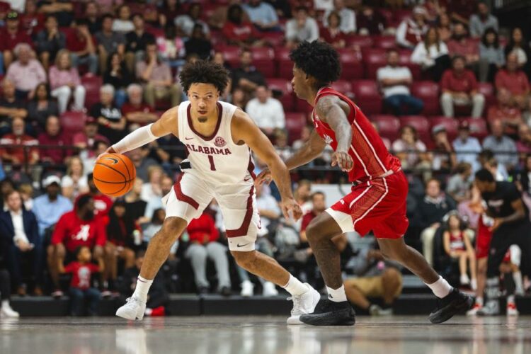 Nov 8, 2024; Tuscaloosa, Alabama, USA; Alabama Crimson Tide guard Mark Sears (1) drives the ball against Arkansas State Red Wolves guard Terrance Ford Jr. (11) during the second half at Coleman Coliseum. Mandatory Credit: Will McLelland-Imagn Images