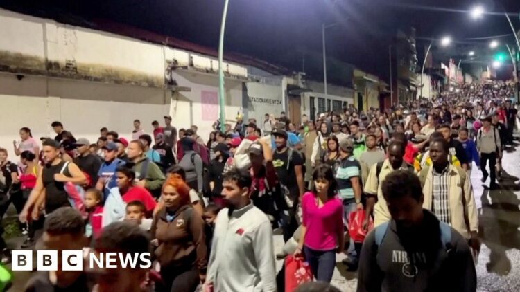 Crowds of people walking streets at night