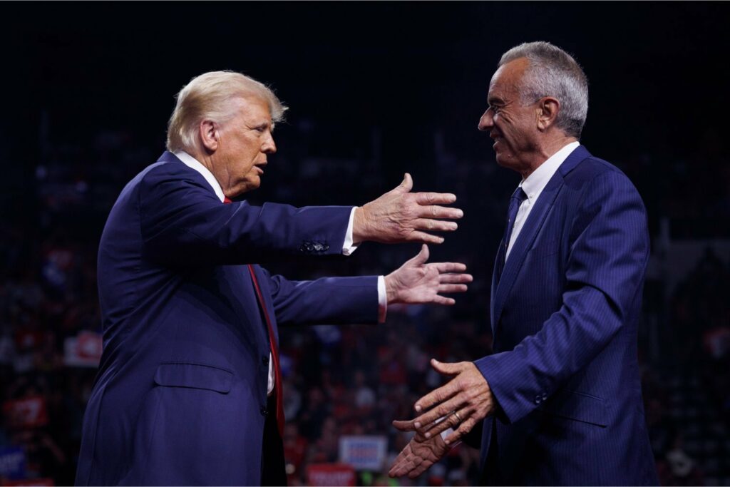 Donald Trump greeting Robert F. Kennedy Jr. on stage during a campaign event at Desert Diamond Arena in Glendale, Arizona, on August 23, 2024.