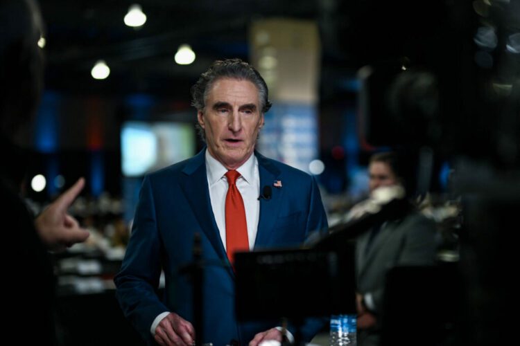 Gov. Doug Burgum of North Dakota speaks to reporters at the National Constitution Center in Philadelphia in advance of the presidential debate between former President Donald Trump and Vice President Kamala Harris, Sept. 10, 2024. President-elect Trump has tapped Burgum to lead the Interior Department, leading the new administrations plans to open federal lands and waters to oil and gas drilling. (Kenny Holston/The New York Times)