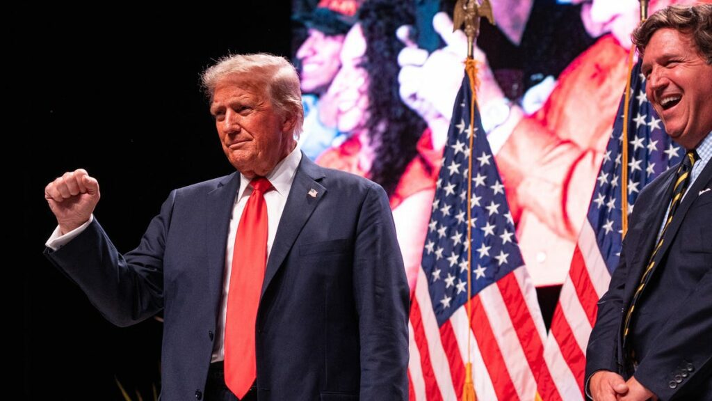 Trump's friendly chat with Carlson revs up supporters at AZ rally