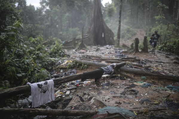 Clothing and garbage litter the trail where migrants have been trekking across the Darien Gap from Colombia to Panama in hopes of eventually reaching the United States, May 10, 2023. (AP Photo/Ivan Valencia, File)