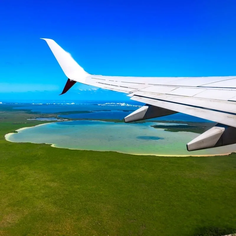 Aerial View Of Plane Wing As It Approaches Cancun In Mexico, Riviera Maya, Mexican Caribbean
