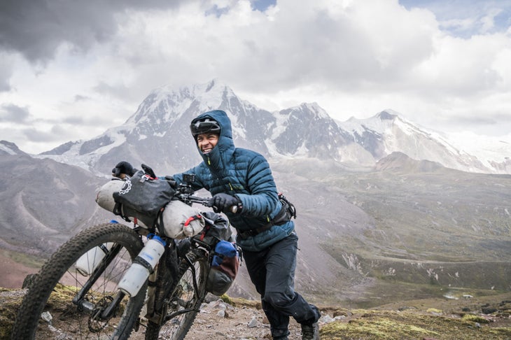 Bikepacking in the men's Infinity Microlight Down Jacket from Rab
