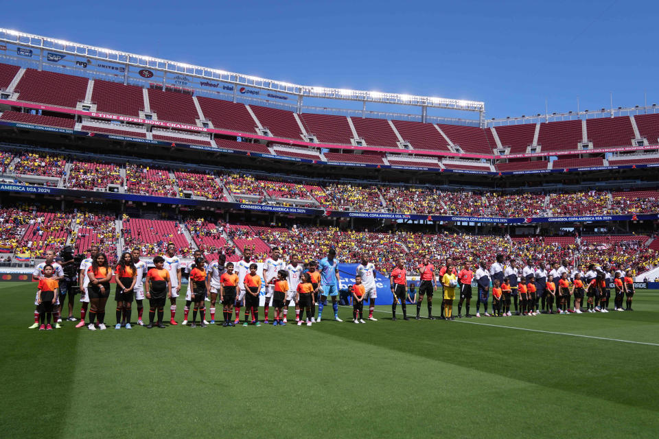 Jun 22, 2024; Santa Clara, CA, USA; Venezuela and Ecuador players stand on the pitch before the game at Levi's Stadium. Mandatory Credit: Darren Yamashita-USA TODAY Sports