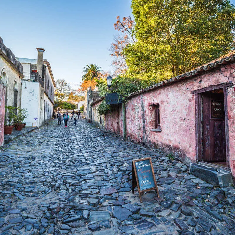 Cobblestone Laden Street Lined With Historical Colonial Era Houses In Colonia Del Sacramento, Uruguay, South America