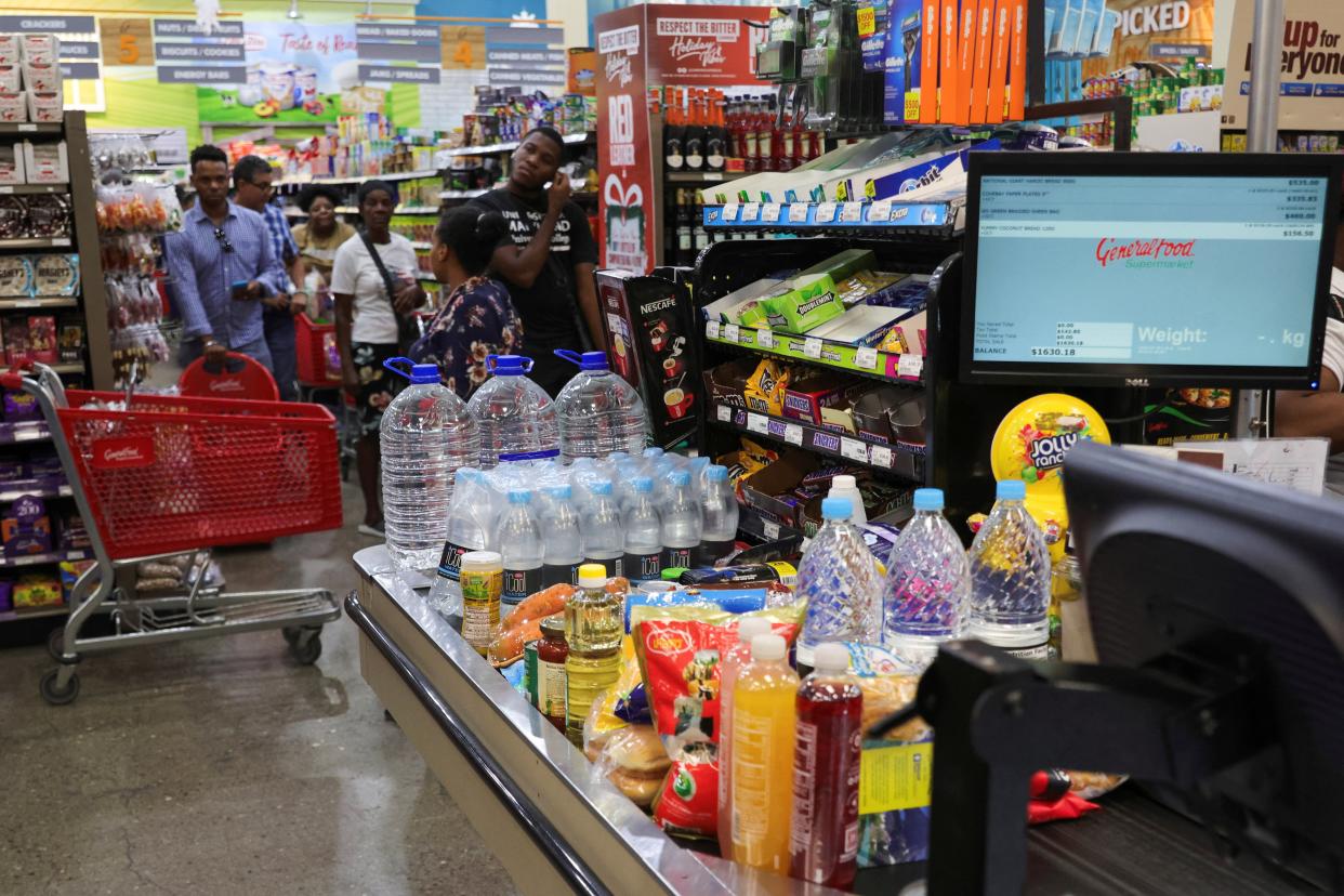 People wait to buy groceries in Kingston, Jamaica ahead of Hurricane Beryl’s arrival (REUTERS)