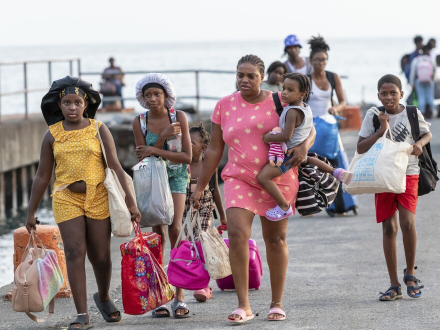 Evacuees from Union Island arrive in Kingstown, St. Vincent and the Grenadines, Tuesday, July 2, 2024. The island, in the Grenadines archipelago, was hit by Hurricane Beryl. 