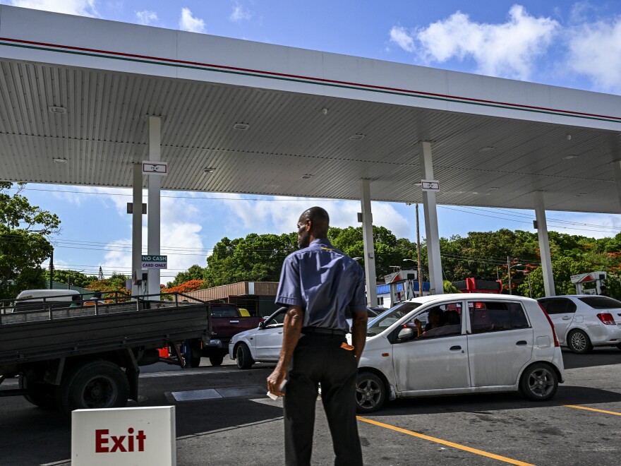 Vehicles line up at a gas station as people prepare for the arrival of Hurricane Beryl in Bridgetown, Barbados on June 30.