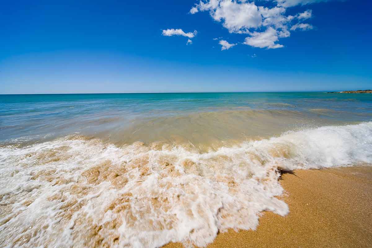 Venezuela beaches margarita island foamy waves lapping on the sand