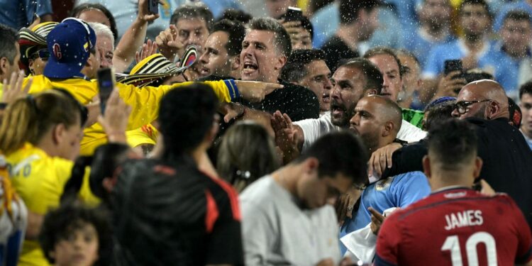 Uruguay players and Colombia fans fight in stands