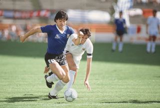 Diego Maradona in action for Argentina against Uruguay at the 1986 World Cup.