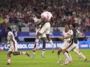 Canada midfielder Ismael Kone (8) celebrates with teammates after making the winning penalty kick during a Copa America quarterfinal soccer match against Venezuela in Arlington, Texas, Friday, July 5, 2024.