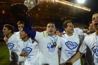 Velez Sarsfield players celebrate winning the Argentine title in June 2013.