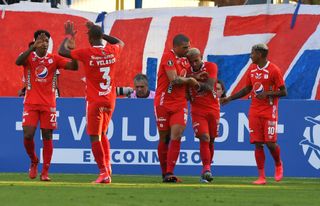 America de Cali players celebrate a goal against Universidad Catolica in the Copa Libertadores in March 2020.