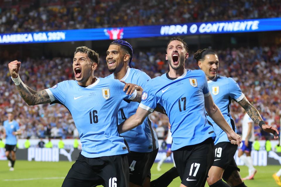 KANSAS CITY, MISSOURI - JULY 01: Mathias Olivera of Uruguay celebrates with teammates after scoring the team's first goal during the CONMEBOL Copa America 2024 Group C match between United States and Uruguay at GEHA Field at Arrowhead Stadium on July 01, 2024 in Kansas City, Missouri. (Photo by Michael Reaves/Getty Images)