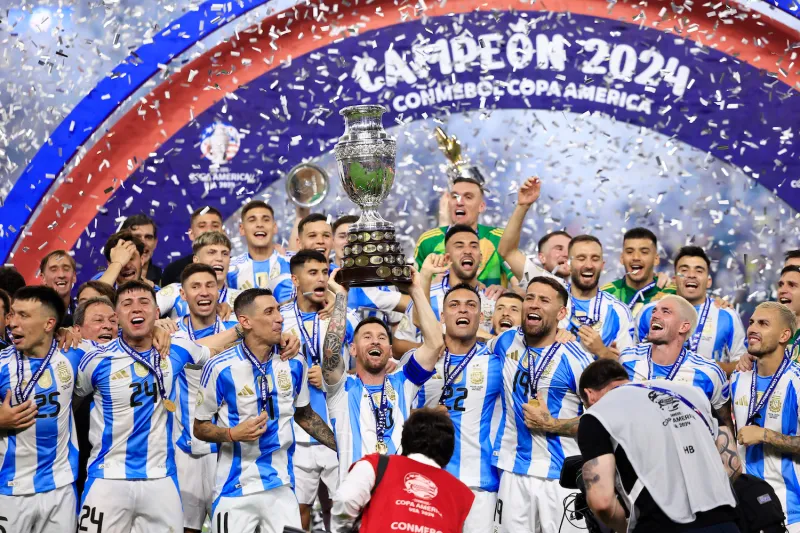 Soccer player Lionel Messi of Argentina celebrates with his team after their victory over Colombia in the final match of the Copa América tournament at Hard Rock Stadium in Miami on July 14.