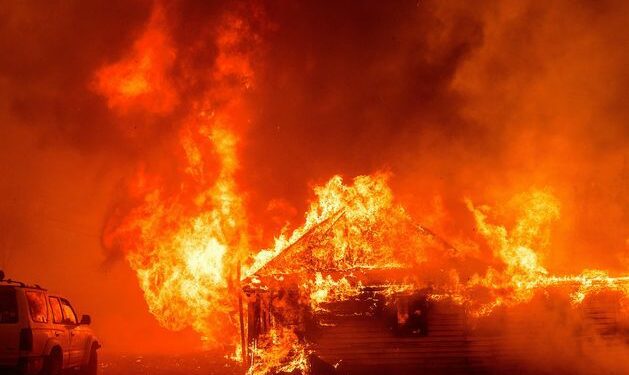 Man arrested for pushing burning car into gully, starting California’s largest active wildfire