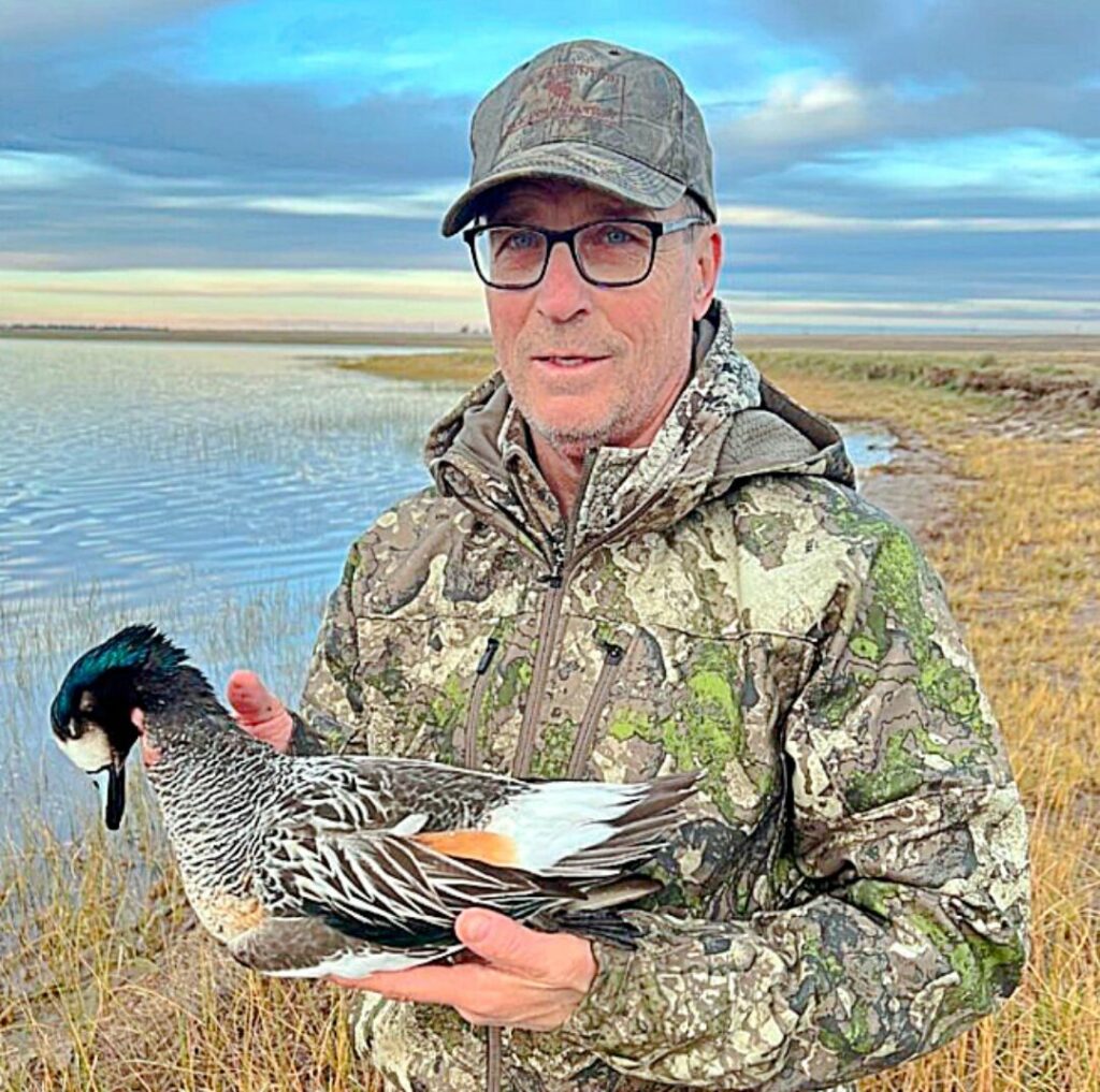 Terry Wieczorek holds an Argentine Widgeon. Wieczorek has hunted waterfowl from Alaska to Argentina.