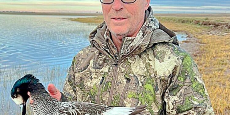 Terry Wieczorek holds an Argentine Widgeon. Wieczorek has hunted waterfowl from Alaska to Argentina.