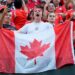 A soccer fan holds a Canadian flag prior to a Copa America Group A soccer match against Chile, in Orlando, Fla., Saturday, June 29, 2024. (John Raoux / AP Photo)