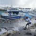 Fishermen pull a boat damaged by Hurricane Beryl back to the dock at the Bridgetown Fisheries in Barbados, Monday, July 1, 2024.
