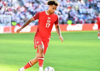 Canada right wing back Tajon Buchanan dribbles with the ball during the game