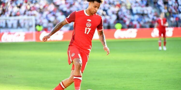 Canada right wing back Tajon Buchanan dribbles with the ball during the game