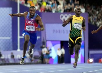 ‘America! I told you!’ Lyles win 100-meter gold in photo finish at Paris Olympics