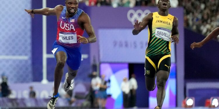 ‘America! I told you!’ Lyles win 100-meter gold in photo finish at Paris Olympics
