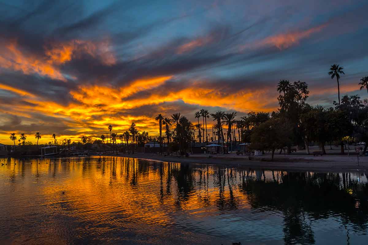 beaches in arizona crowded dramatic orange sunset over Lake Havasu