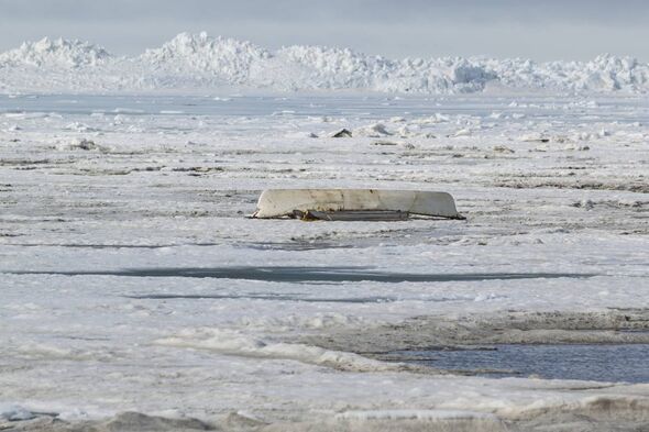 An upside down umiaq (boat) on the pack ice of the Arctic Ocean signaling an unsucessful whale hunt for the spring