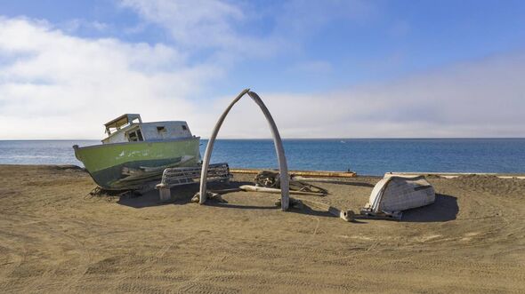 A whale bow arch and a marooned small boat