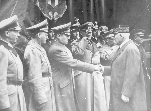 Marshal Petain (right), Leader of the Vichy Puppet Government, shaking hands with Otto Abetz (left)