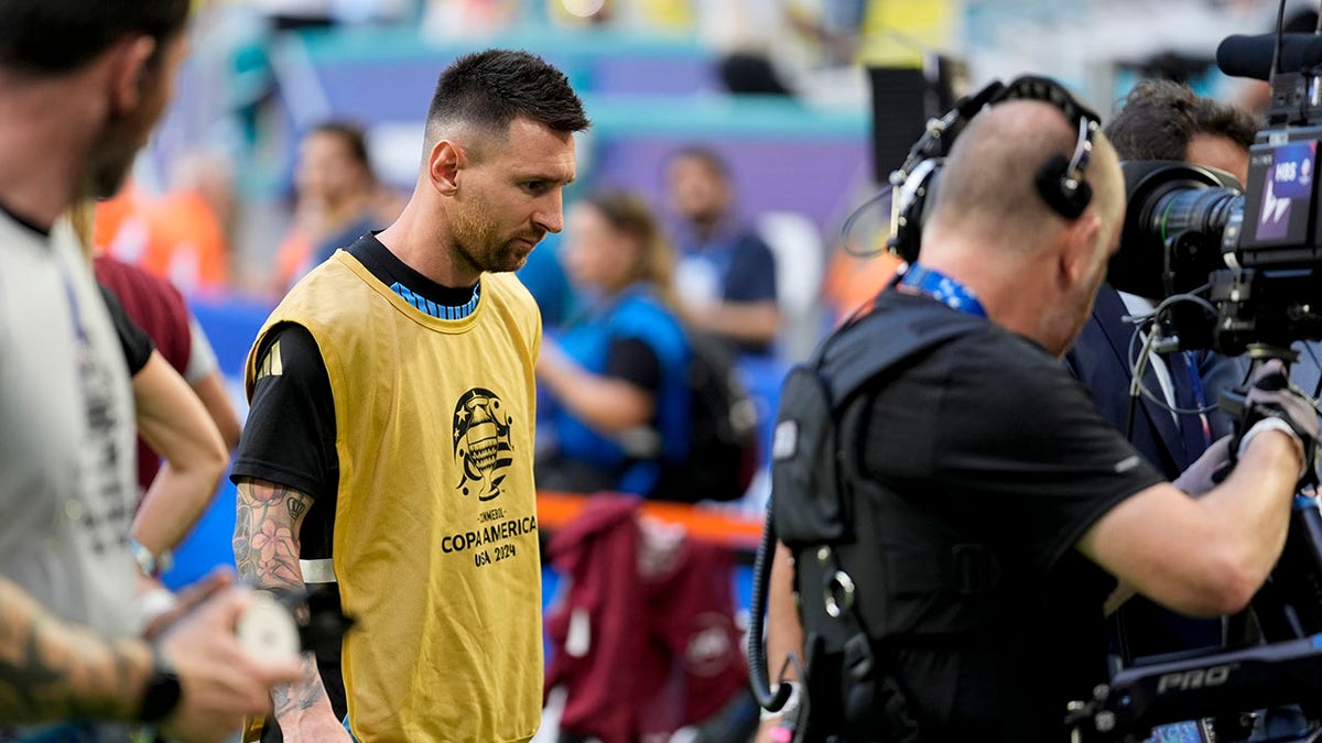 Lionel Messi walks off the pitch