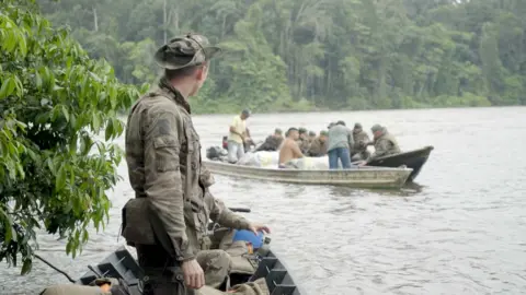 Vadim watches on as the legionnaires stop and search local people in the hope of catching gold smugglers