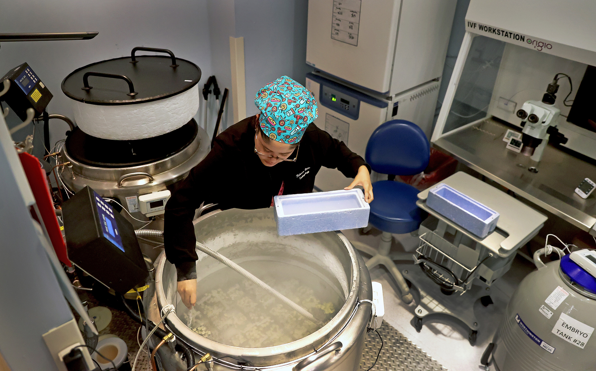 Rebecca Brito, an embryologist, works in the IVF lab at the Brigham & Women's Hospital in Boston, March 15, 2024.