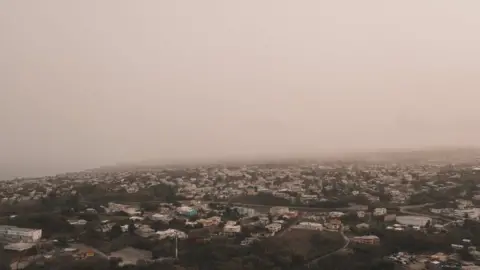 Reuters Dust coming from the Sahara desert floats over the city of Bridgetown, Barbados, June 22, 2020, in this picture obtained from social media