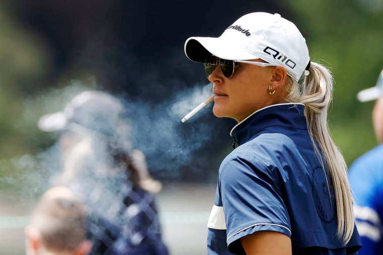 LANCASTER, PENNSYLVANIA - MAY 30: Charley Hull of England smokes a cigarette on the 9th tee during the first round of the U.S. Women's Open Presented by Ally at Lancaster Country Club on May 30, 2024 in Lancaster, Pennsylvania. (Photo by Sarah Stier/Getty Images)