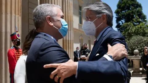 Reuters Colombia's President Ivan Duque and Ecuador's President-elect Guillermo Lasso embrace, in Bogota, Colombia April 20, 2021