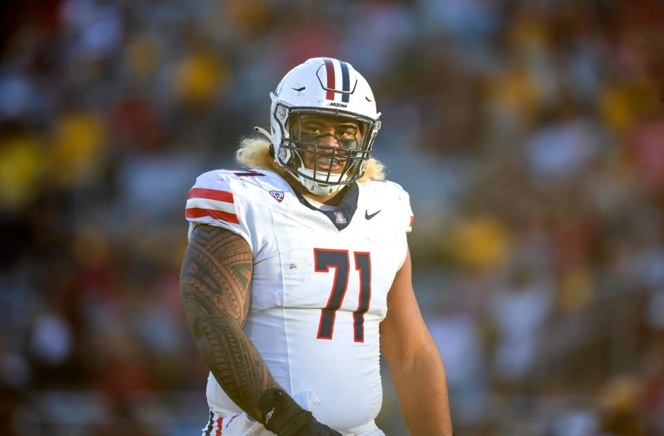 Nov 25, 2023; Tempe, Arizona, USA; Arizona Wildcats offensive lineman Jonah Savaiinaea (71) against the Arizona State Sun Devils during the Territorial Cup at Mountain America Stadium. Mandatory Credit: Mark J. Rebilas-USA TODAY Sports