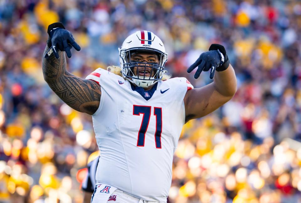 Nov 25, 2023; Tempe, Arizona, USA; Arizona Wildcats offensive lineman Jonah Savaiinaea (71) celebrates a touchdown against the Arizona State Sun Devils in the second half of the Territorial Cup at Mountain America Stadium. Mandatory Credit: Mark J. Rebilas-USA TODAY Sports