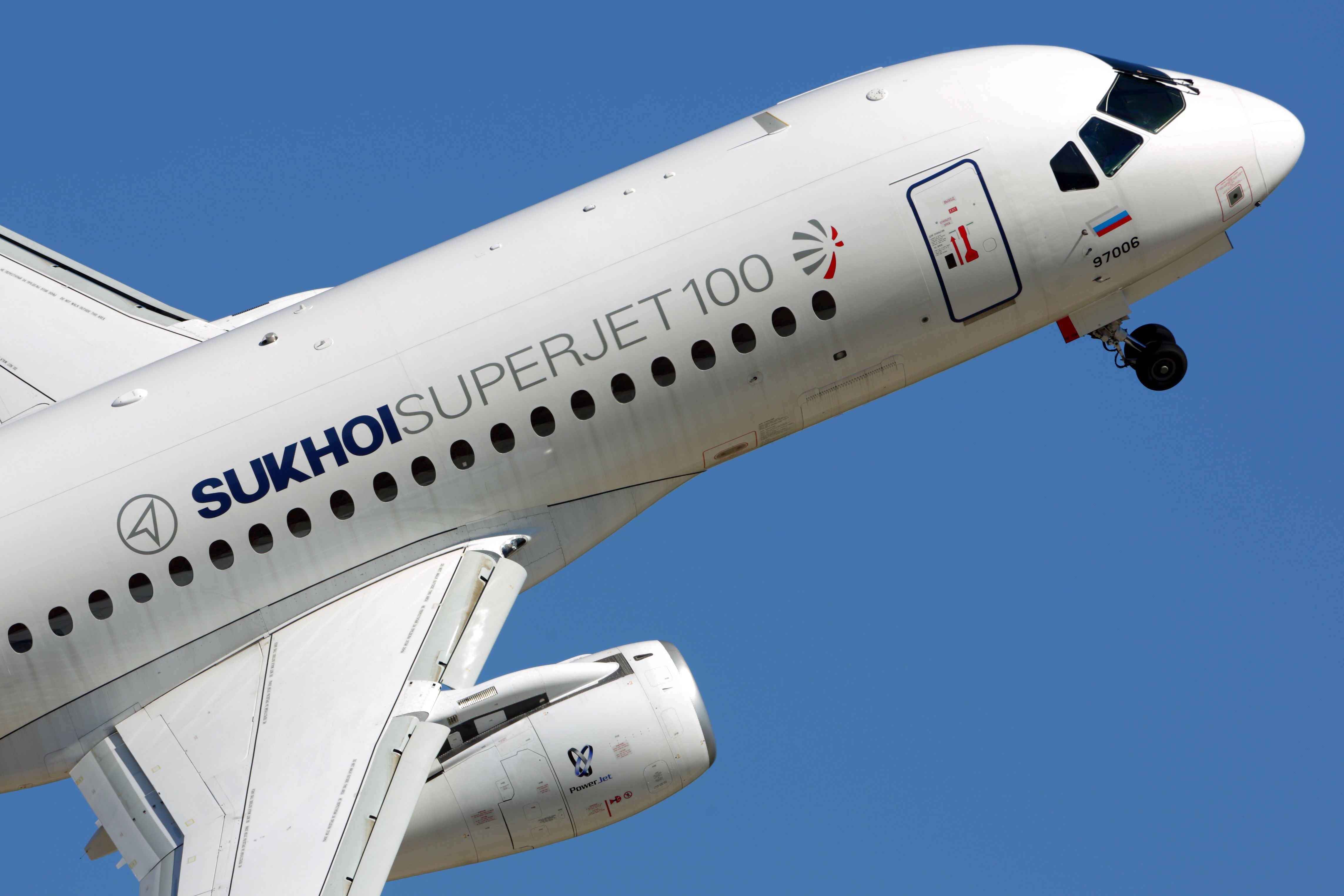 Sukhoi Superjet 100 flying shutterstock_347534399