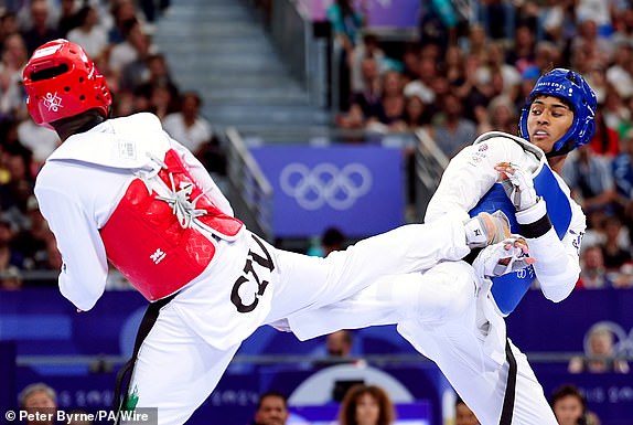 Great Britain's Caden Cunningham (right) and CÃ´te d'Ivoire's Cheick Sallah Cisse  during the Men's +80kg semi final contest at the Grand Palais on the fifteenth day of the 2024 Paris Olympic Games in France. Picture date: Saturday August 10, 2024. PA Photo. Photo credit should read: Peter Byrne/PA Wire.RESTRICTIONS: Use subject to restrictions. Editorial use only, no commercial use without prior consent from rights holder.