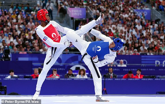 Great Britain's Caden Cunningham (right) and Cuba's Rafael Alba during the Men's +80kg  quarter final contest at the Grand Palais on the fifteenth day of the 2024 Paris Olympic Games in France. Picture date: Saturday August 10, 2024. PA Photo. Photo credit should read: Peter Byrne/PA Wire.RESTRICTIONS: Use subject to restrictions. Editorial use only, no commercial use without prior consent from rights holder.