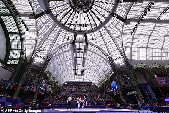 Cuba's Rafael Alba (C) competes against Britain's Caden Cunningham in the taekwondo men's +80kg quarter-final bout of the Paris 2024 Olympic Games at the Grand Palais in Paris on August 10, 2024. (Photo by David GRAY / AFP) (Photo by DAVID GRAY/AFP via Getty Images)