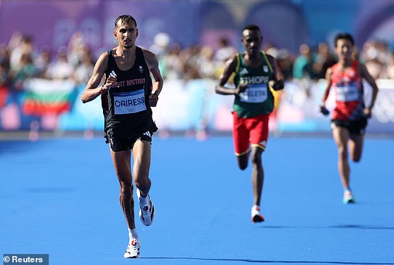 Paris 2024 Olympics - Athletics - Men's Marathon - Paris, France - August 10, 2024. Emile Cairess of Britain approaches the finish line at Invalides to finish fourth. REUTERS/Isabel Infantes