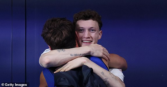 PARIS, FRANCE - AUGUST 10: Bronze Medalist Noah Williams of Team Great Britain embraces Thomas Daley of Team Great Britain after competing in the Men's 10m Platform Final on day fifteen of the Olympic Games Paris 2024 at Aquatics Centre on August 10, 2024 in Paris, France. (Photo by Clive Rose/Getty Images)